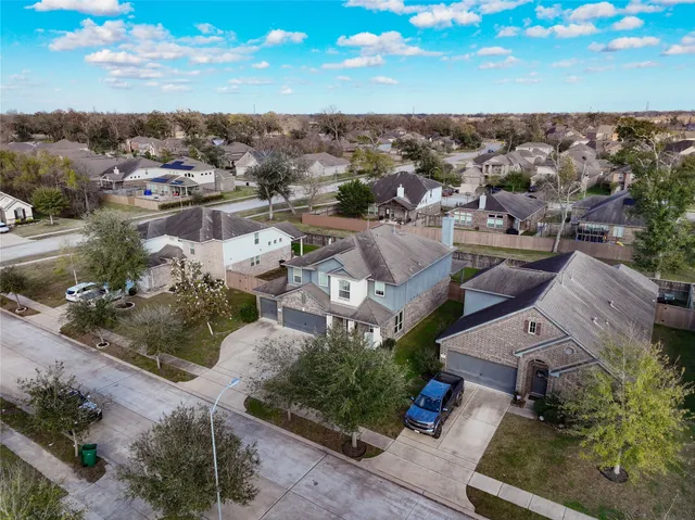 an aerial view of a house with a garden