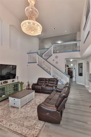 a living room with furniture and a flat screen tv