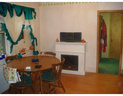 101 Samuel Street Springfield, MA 01109 - Photo 2 of 8 a dining room with furniture and a fireplace