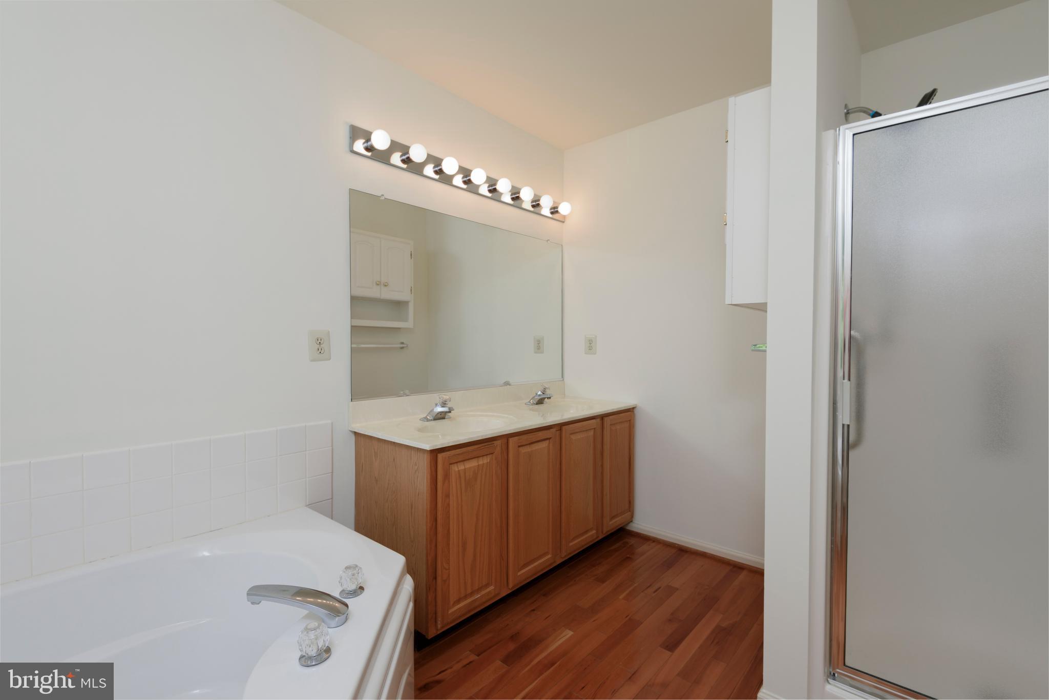 403 East Glenview Drive West Grove, PA 19390 - Photo 15 of 25 a bathroom with a tub sink and mirror
