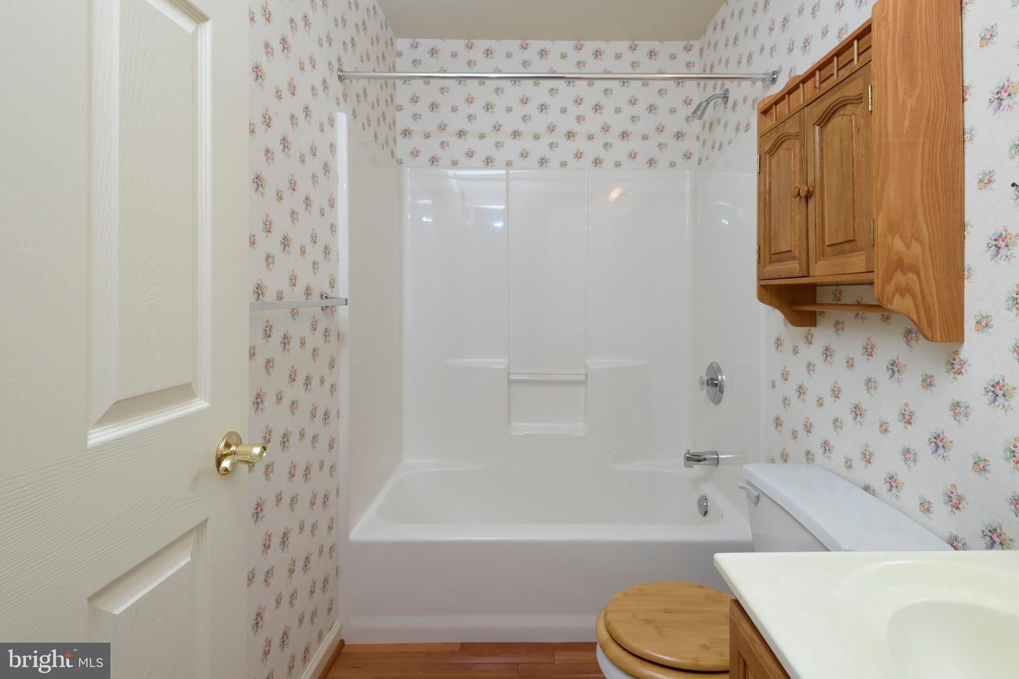 403 East Glenview Drive West Grove, PA 19390 - Photo 18 of 25 a bathroom with a toilet and a bathtub