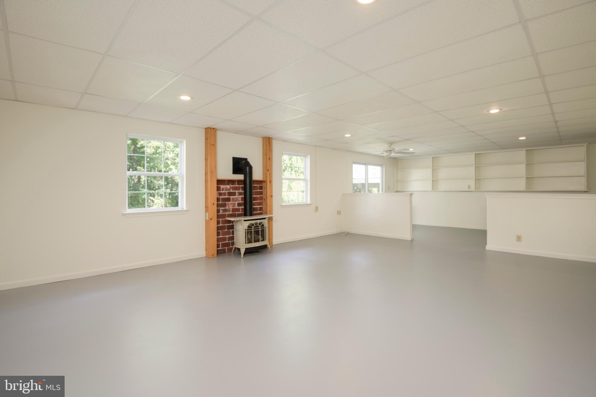 403 East Glenview Drive West Grove, PA 19390 - Photo 22 of 25 an empty room with a kitchen and windows