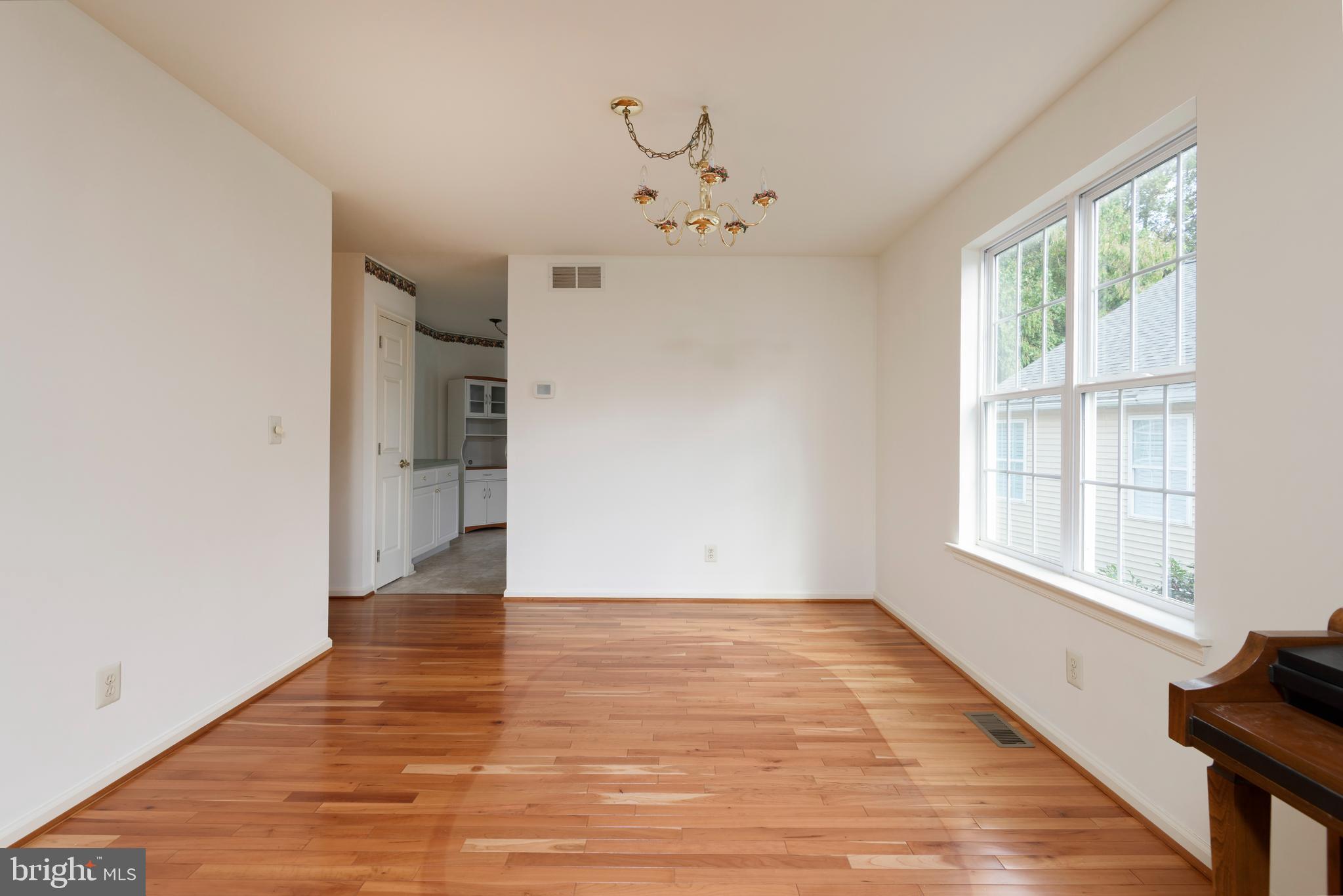 403 East Glenview Drive West Grove, PA 19390 - Photo 5 of 25 wooden floor in an empty room with a window