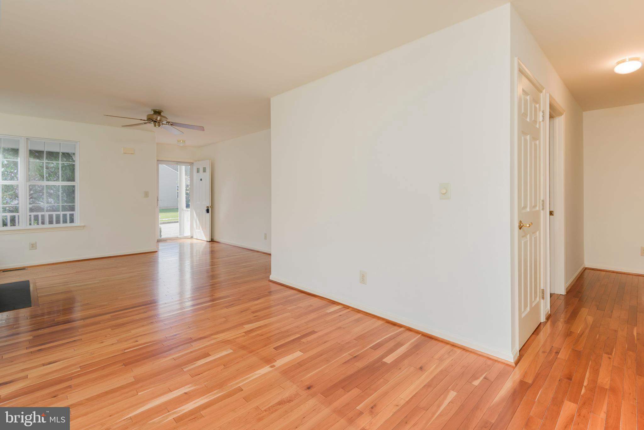 403 East Glenview Drive West Grove, PA 19390 - Photo 6 of 25 an empty room with wooden floor and windows