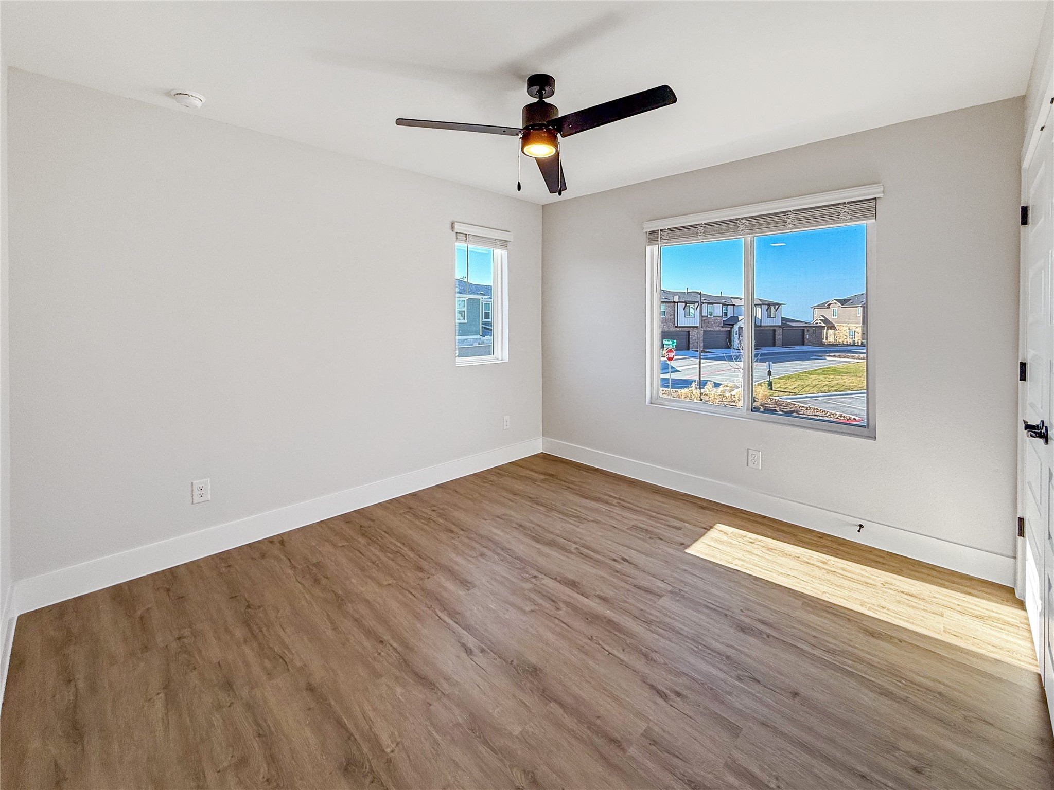 5601 Mobeetie Loop Bee Cave, TX 78738 - Photo 15 of 23 a view of empty room with wooden floor and fan