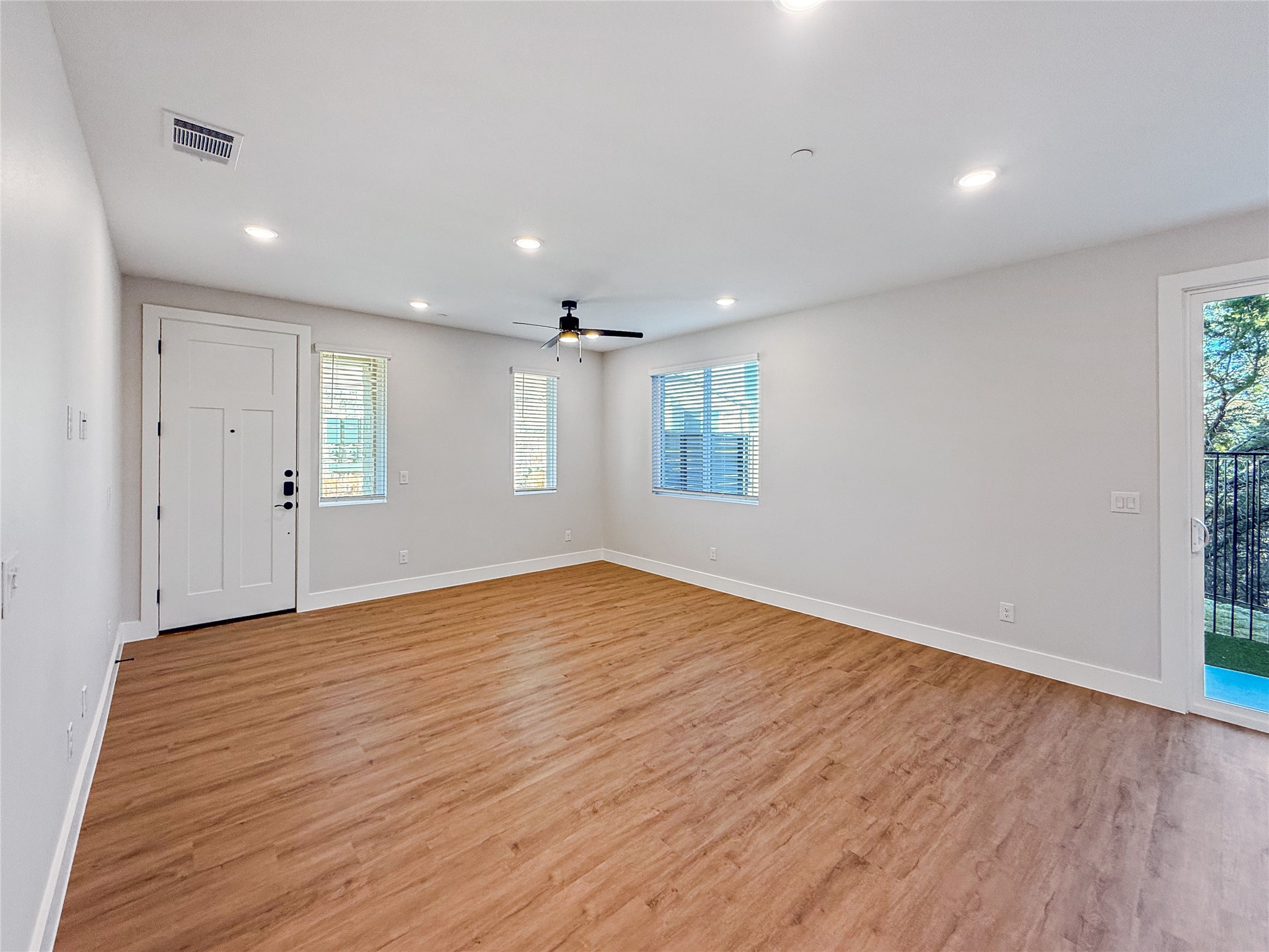 5601 Mobeetie Loop Bee Cave, TX 78738 - Photo 5 of 23 a view of empty room with wooden floor and fan