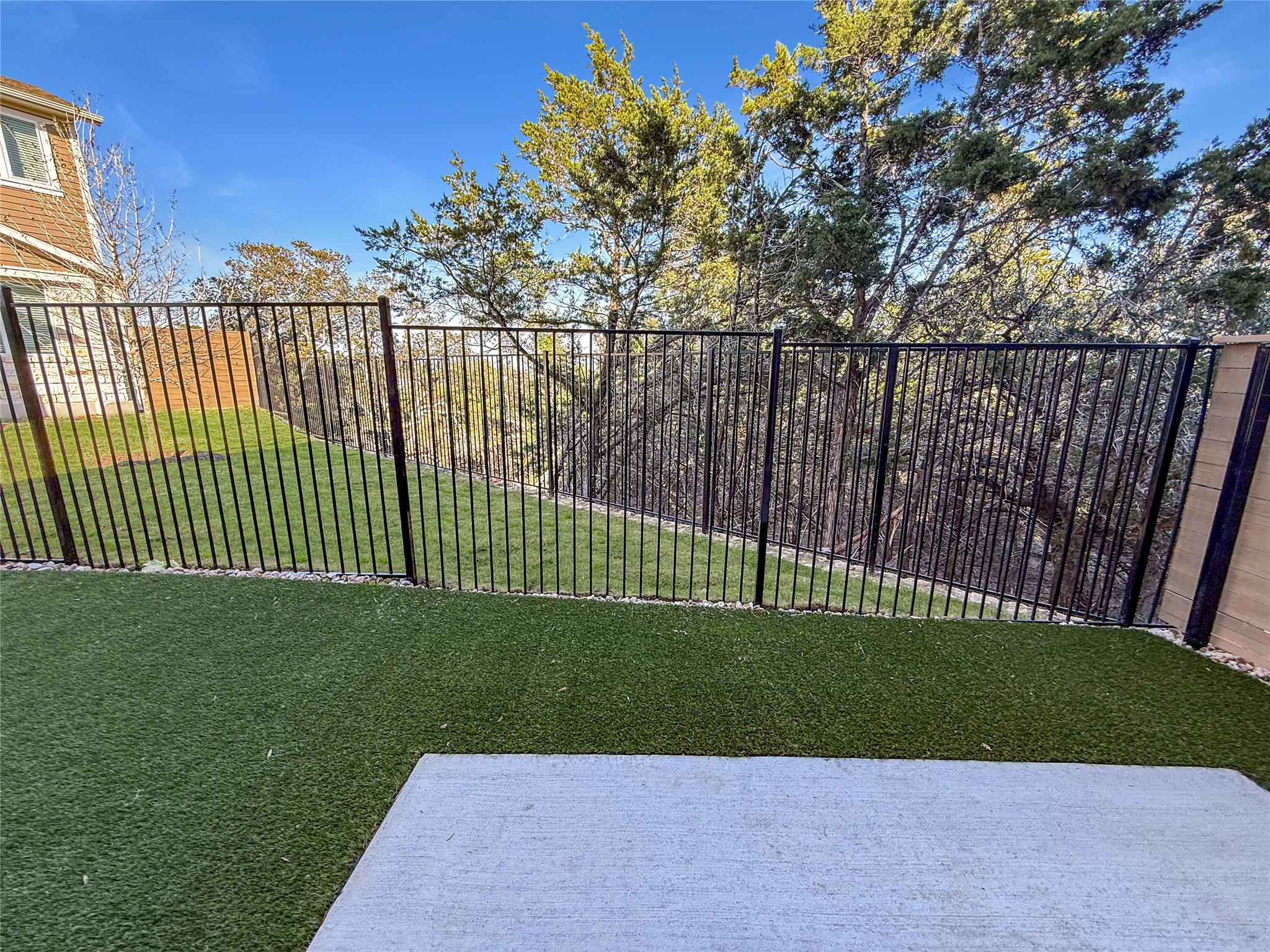 5601 Mobeetie Loop Bee Cave, TX 78738 - Photo 6 of 23 a view of a backyard with a garden