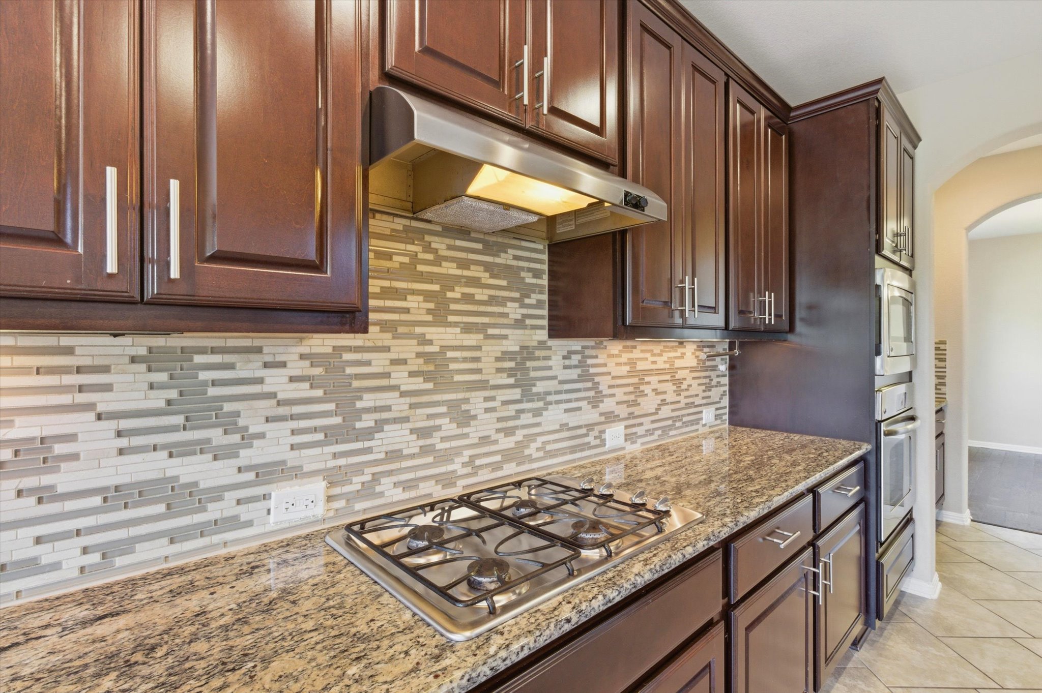 1511 Rimstone Drive Cedar Park, TX 78613 - Photo 11 of 39 Culinary creations come to life in this kitchen, featuring ample cabinetry and a practical gas cooktop.