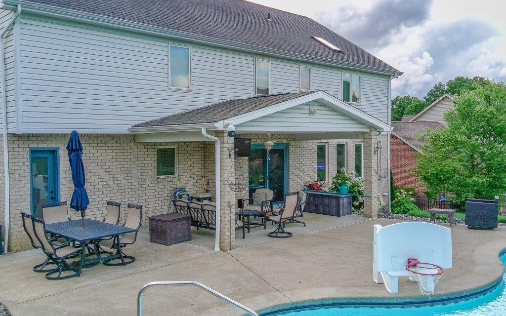 713 Bradgate Drive Irwin, PA 15642 - Photo 26 of 35 a backyard of a house with table and chairs