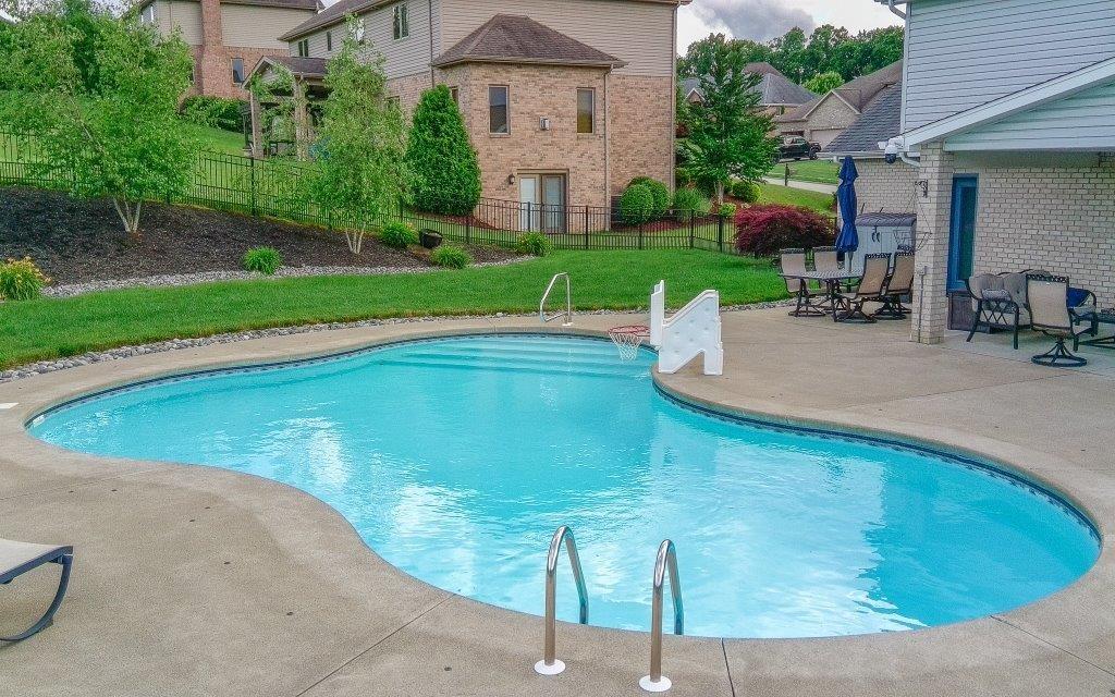 713 Bradgate Drive Irwin, PA 15642 - Photo 29 of 35 a view of a swimming pool with a patio