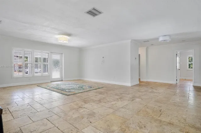 a view of an empty room and window