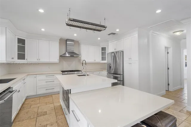 a kitchen with a white stove top oven and refrigerator