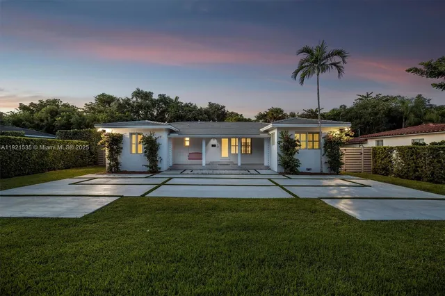 a view of house with outdoor space and swimming pool