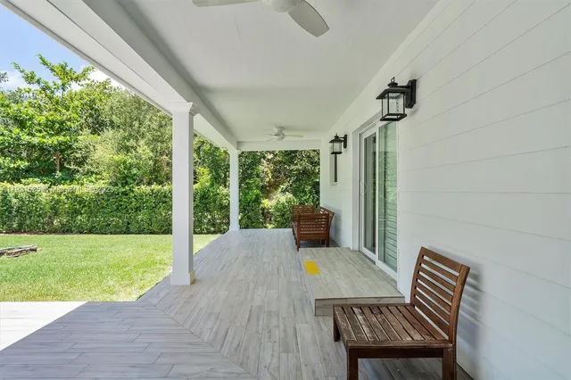 a view of a big room with wooden floor and outdoor space