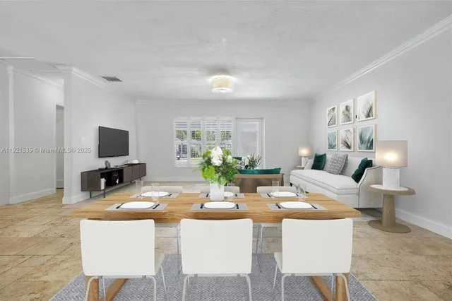a living room with fireplace furniture and a flat screen tv