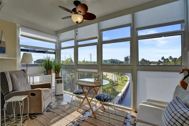a bedroom with two beds and a chandelier