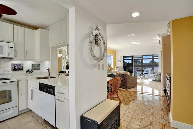 a view of a kitchen and dining room