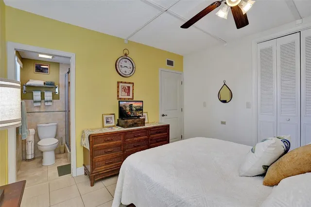 a living room with lots of furniture and kitchen view