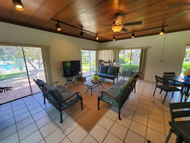 a view of a chairs and tables in the patio