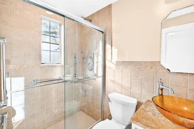 a sidewalk with a trees in the background