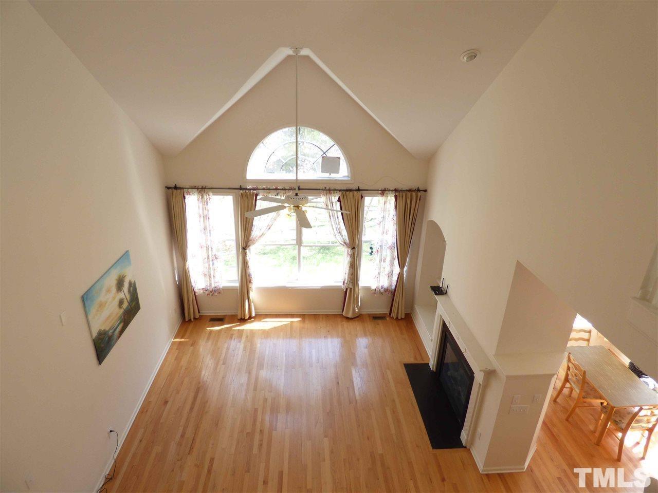 110 North Fields Circle Chapel Hill, NC 27516 - Photo 11 of 24 a view of an empty room with wooden floor and a window