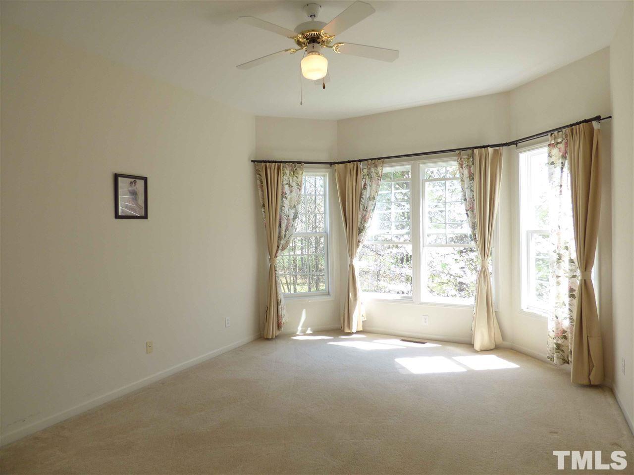 110 North Fields Circle Chapel Hill, NC 27516 - Photo 12 of 24 a view of an empty room with a window and a kitchen