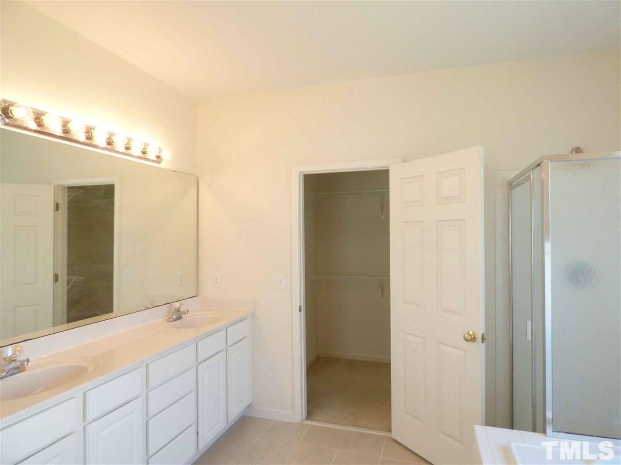 110 North Fields Circle Chapel Hill, NC 27516 - Photo 15 of 24 a bathroom with a double vanity sink and a mirror