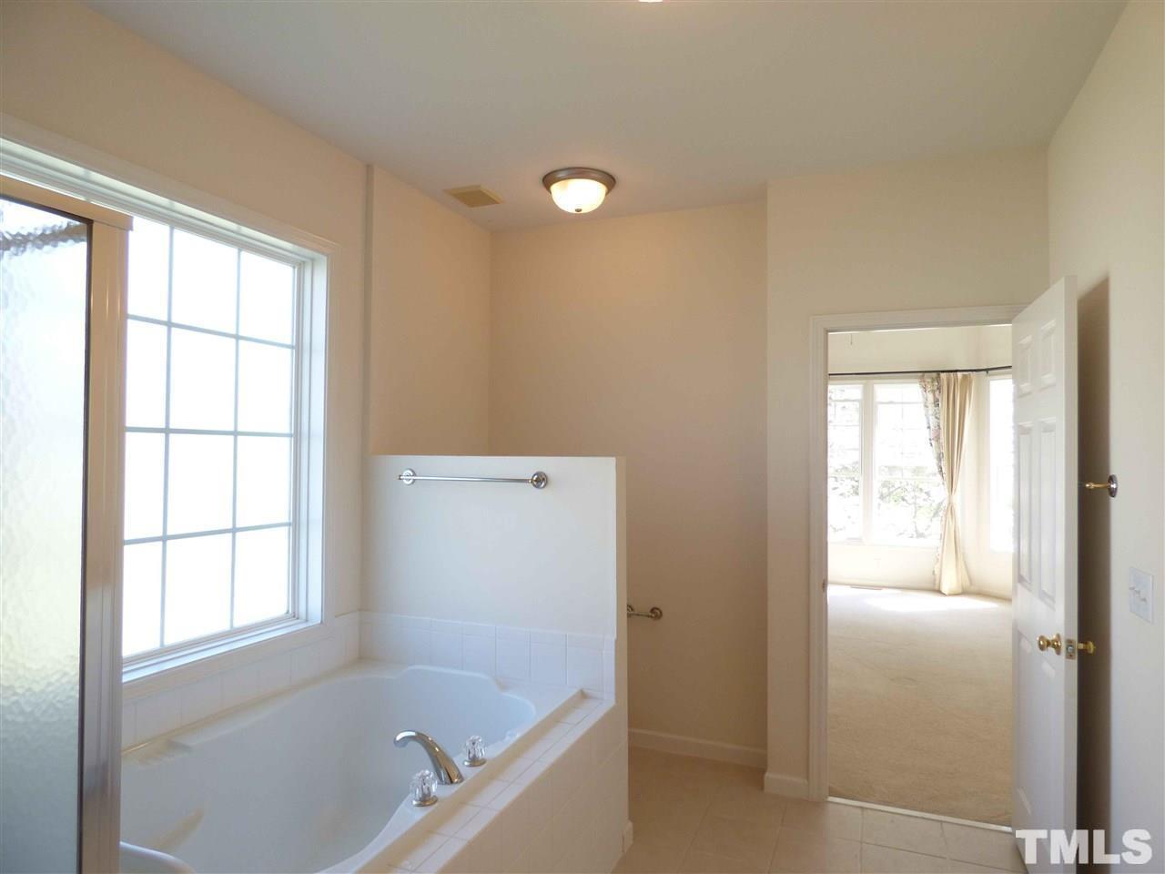 110 North Fields Circle Chapel Hill, NC 27516 - Photo 16 of 24 a bathroom with a bathtub and a shower