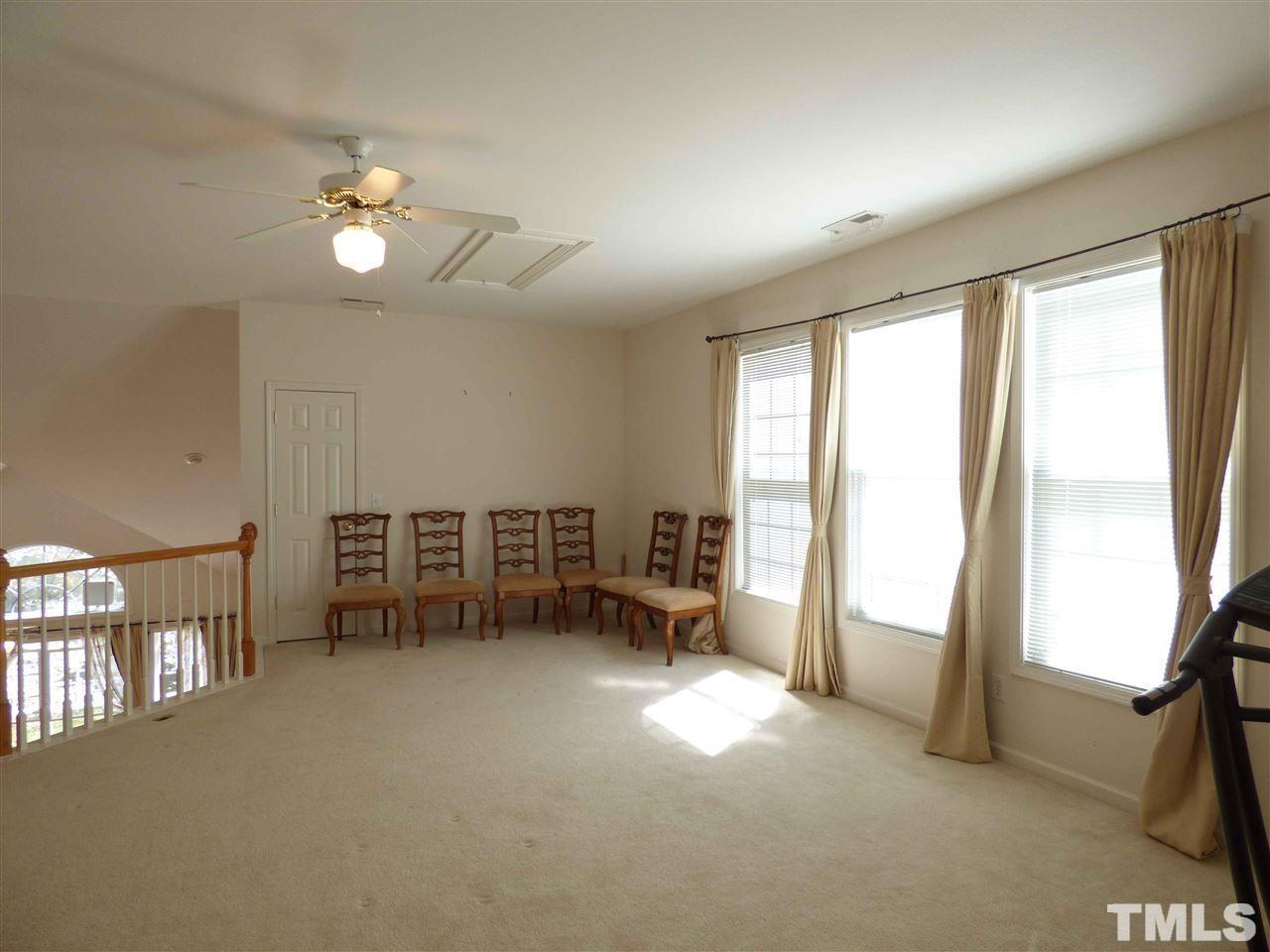 110 North Fields Circle Chapel Hill, NC 27516 - Photo 17 of 24 an empty room with windows and view of chair