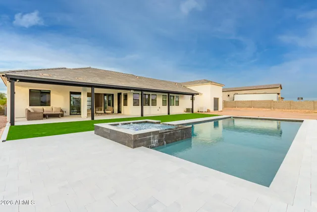 a bathroom with a double vanity sink mirror and shower