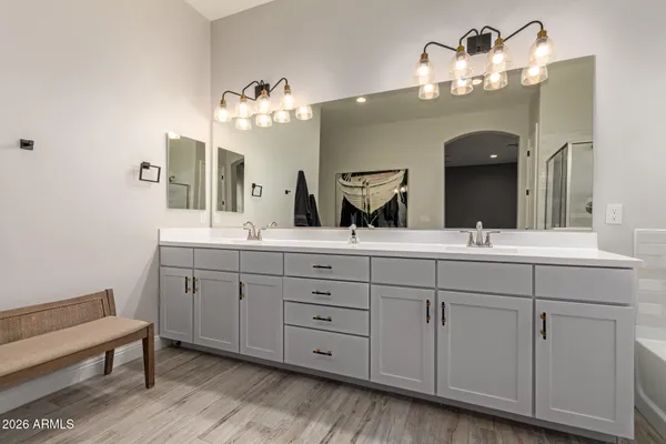 a bathroom with a shower a toilet and a sink