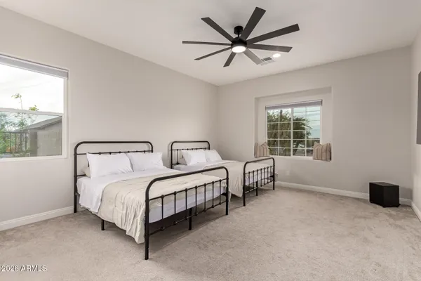 a bathroom with a shower and a white bath tub