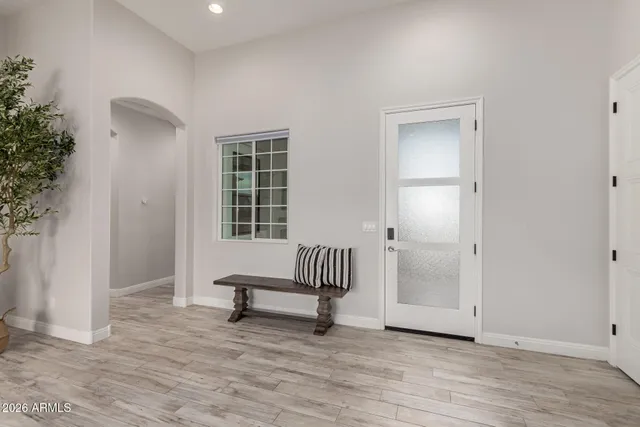 a kitchen with granite countertop a sink appliances and cabinets