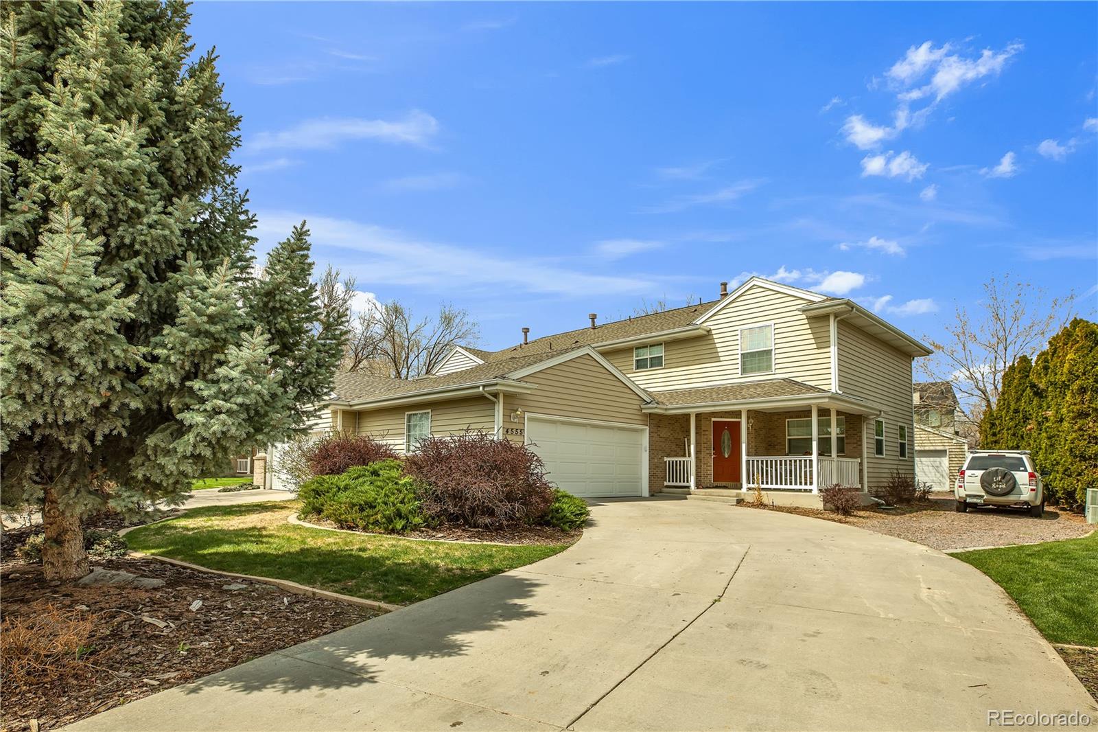 4545 Simms Court Wheat Ridge, CO 80033 - Photo 2 of 28 a front view of a house with a yard