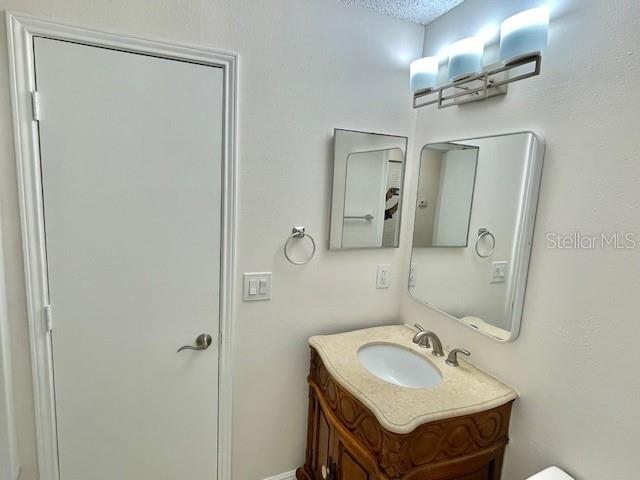 717 Secret Harbor Lane, Unit 309 Lake Mary, FL 32746 - Photo 15 of 20 a bathroom with a sink and a mirror