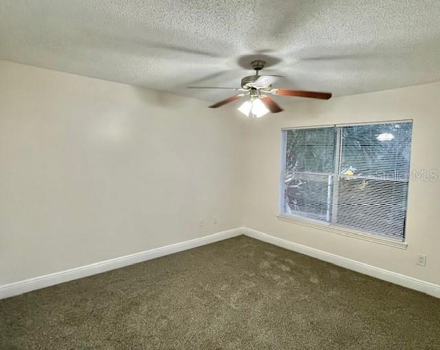 717 Secret Harbor Lane, Unit 309 Lake Mary, FL 32746 - Photo 17 of 20 en empty room with windows and fan
