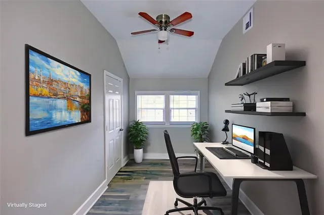 a workspace with furniture window and wooden floor