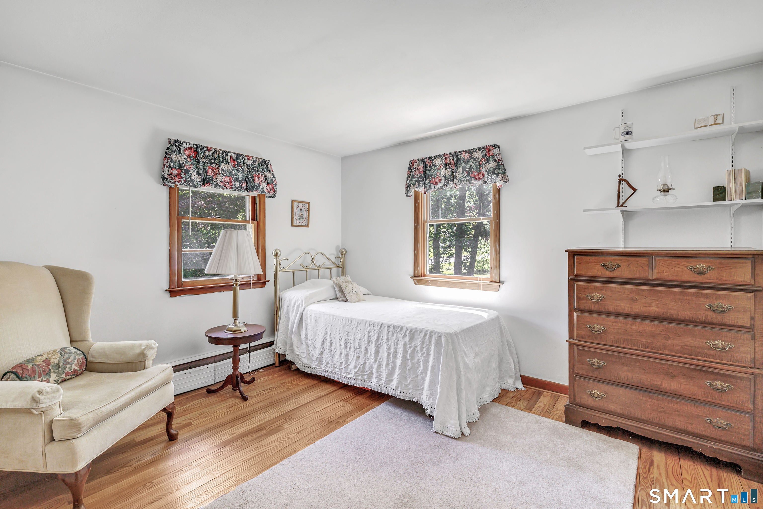 223 Wheeler Road Monroe, CT 06468 - Photo 21 of 35 a bedroom with a bed and wooden floor