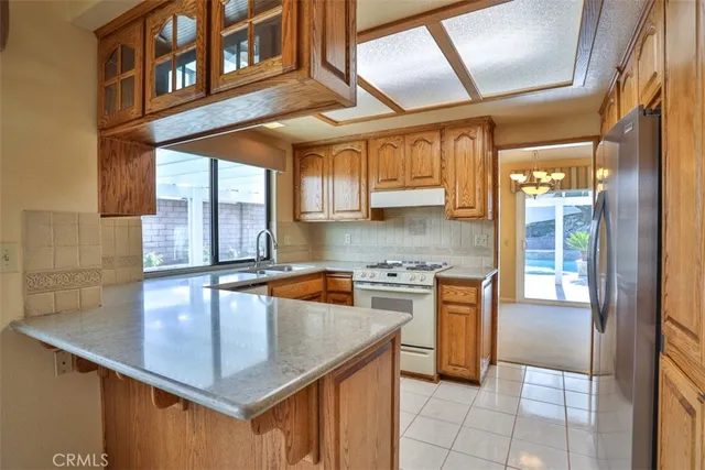 a kitchen with cabinets a sink and appliances