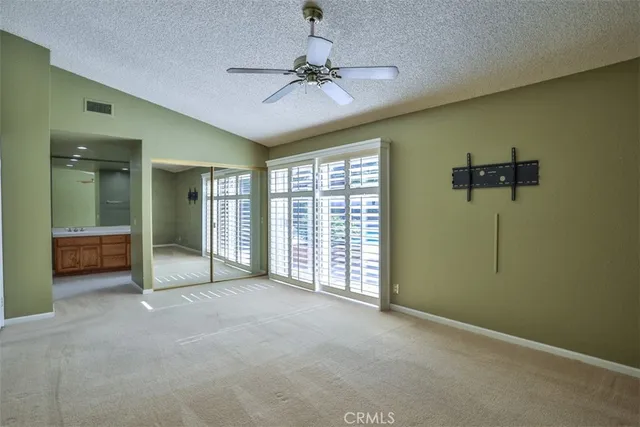 a bathroom with a mirror and a sink
