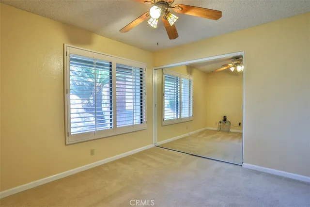 a bathroom with double vanity sinks and a mirror