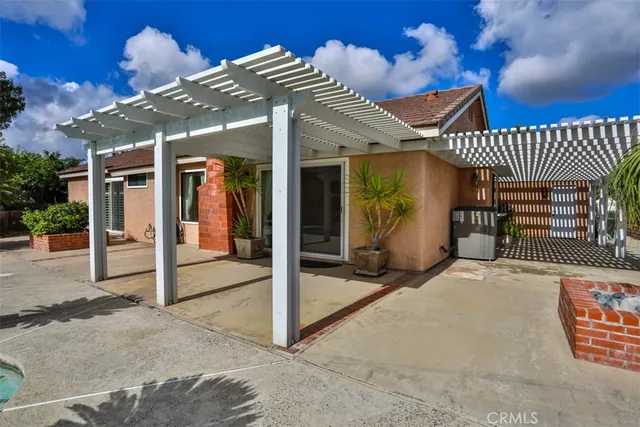 an aerial view of a house with yard and green space