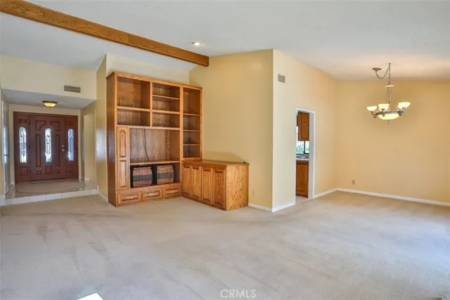 a view of an empty room with a fireplace