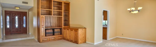 a view of an empty room with a mirror