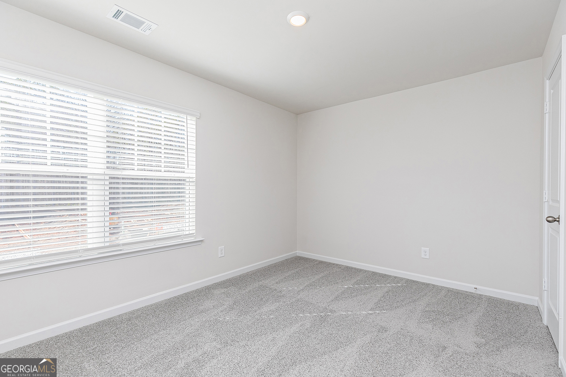 642 Mackenzie Cove Villa Rica, GA 30180 - Photo 16 of 17 an empty room with a window