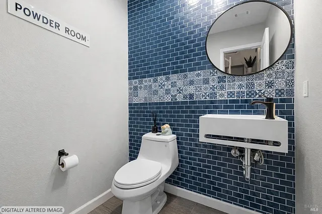 a bedroom with bed and wooden floor