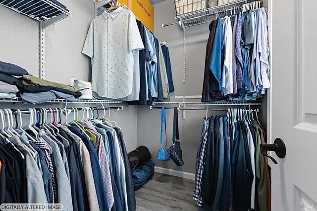 a bathroom with a double vanity sink a mirror and a bathtub