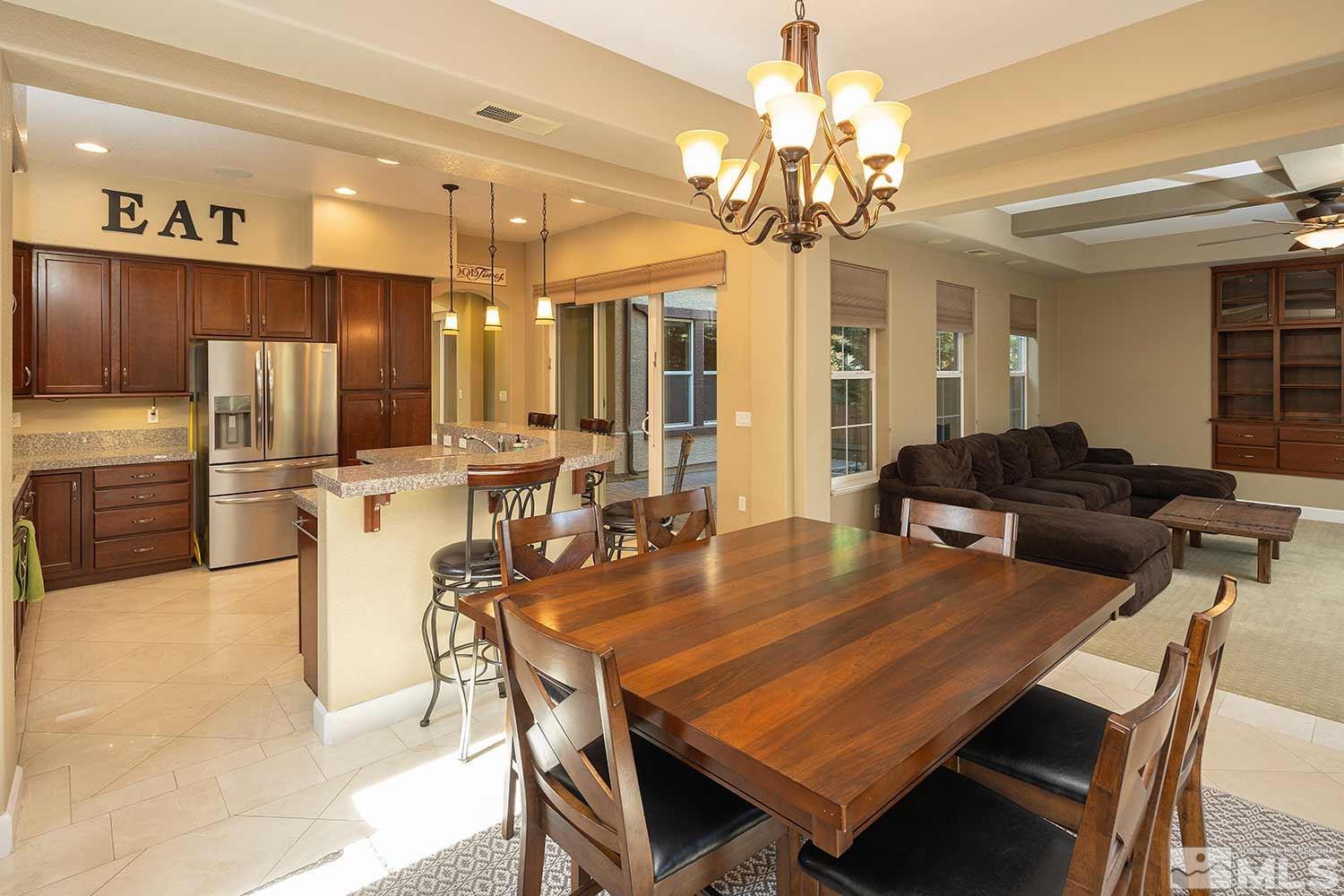 1861 Braemore Drive Reno, NV 89521 - Photo 12 of 40 a view of a dining room with furniture and a chandelier