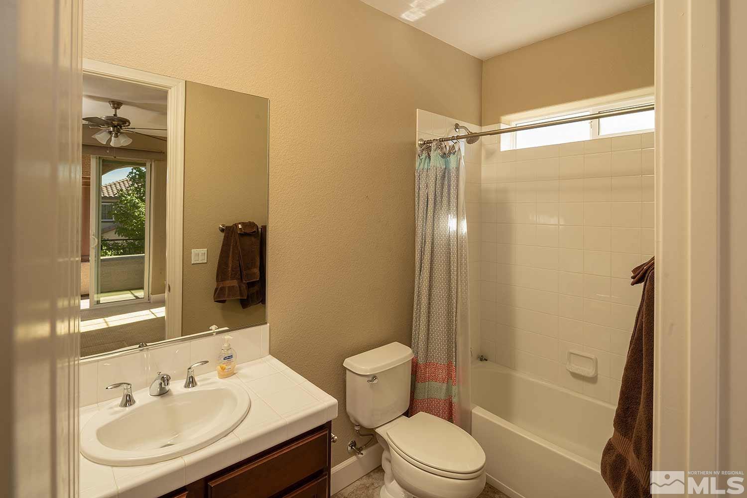 1861 Braemore Drive Reno, NV 89521 - Photo 24 of 40 a bathroom with a sink toilet and shower