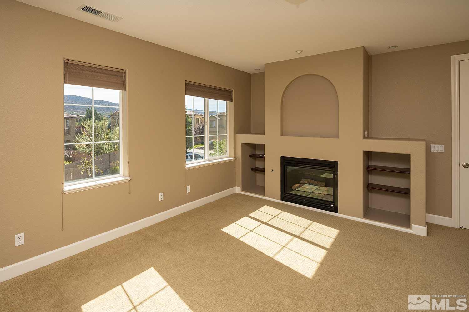 1861 Braemore Drive Reno, NV 89521 - Photo 32 of 40 an empty room with windows and fireplace
